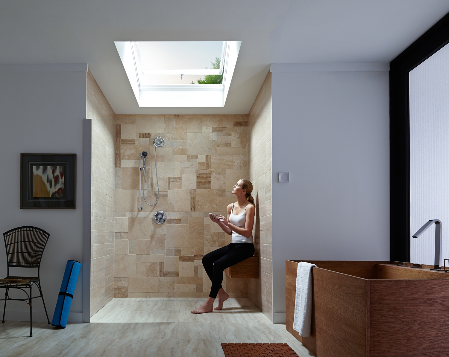 woman standing under open skylight in the shower