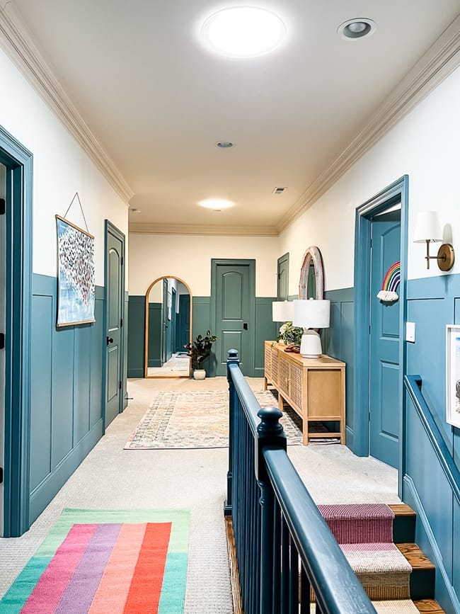 A blue and white hallway with two Sun Tunnel skylights