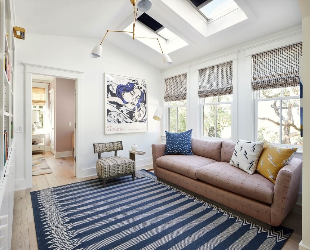Blue and pink living room with two skylights
