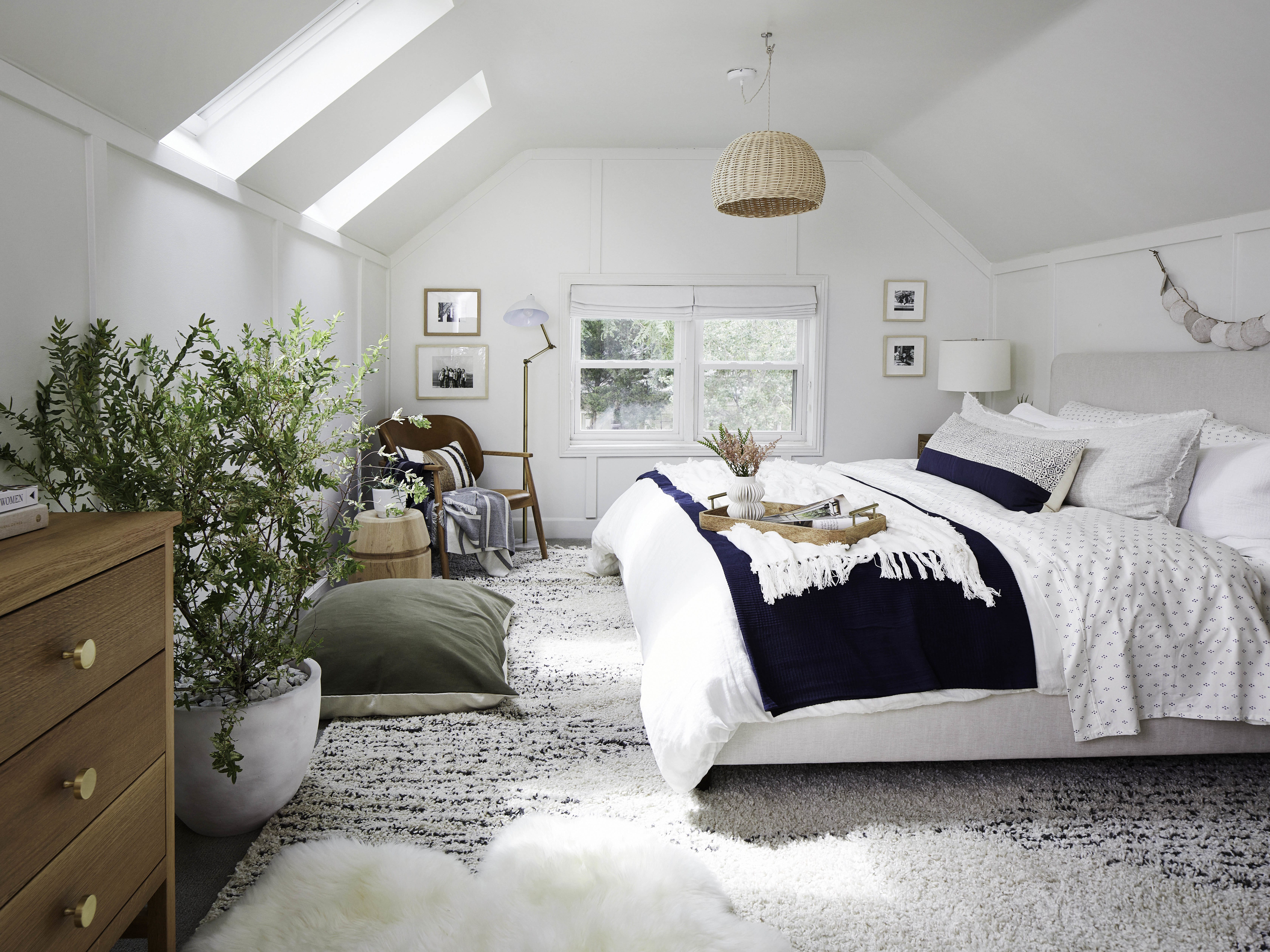 Darkened bedroom with skylight blinds closed
