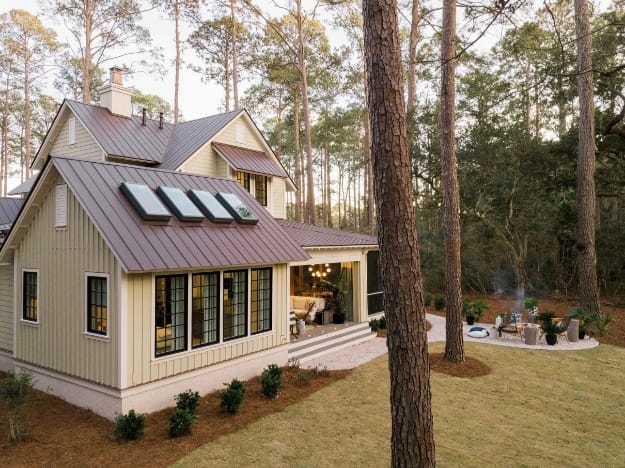 Four skylights on a brown standing seam metal roof