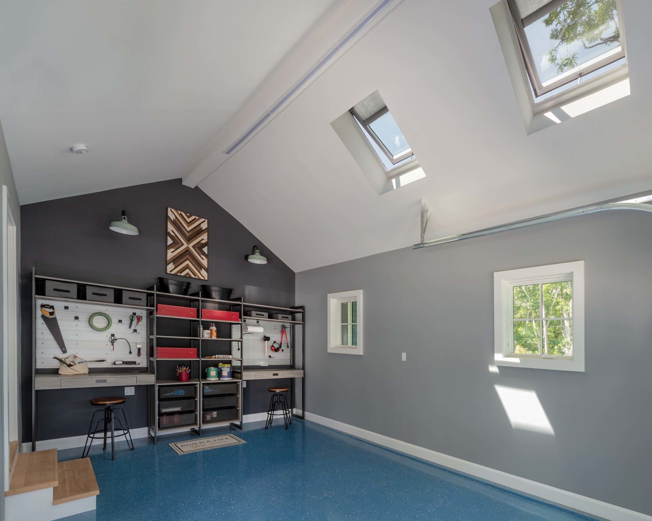 grey and blue garage or maker space with two skylights