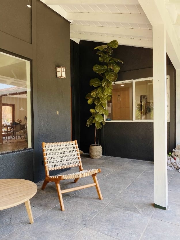 Gray and white porch plants chairs
