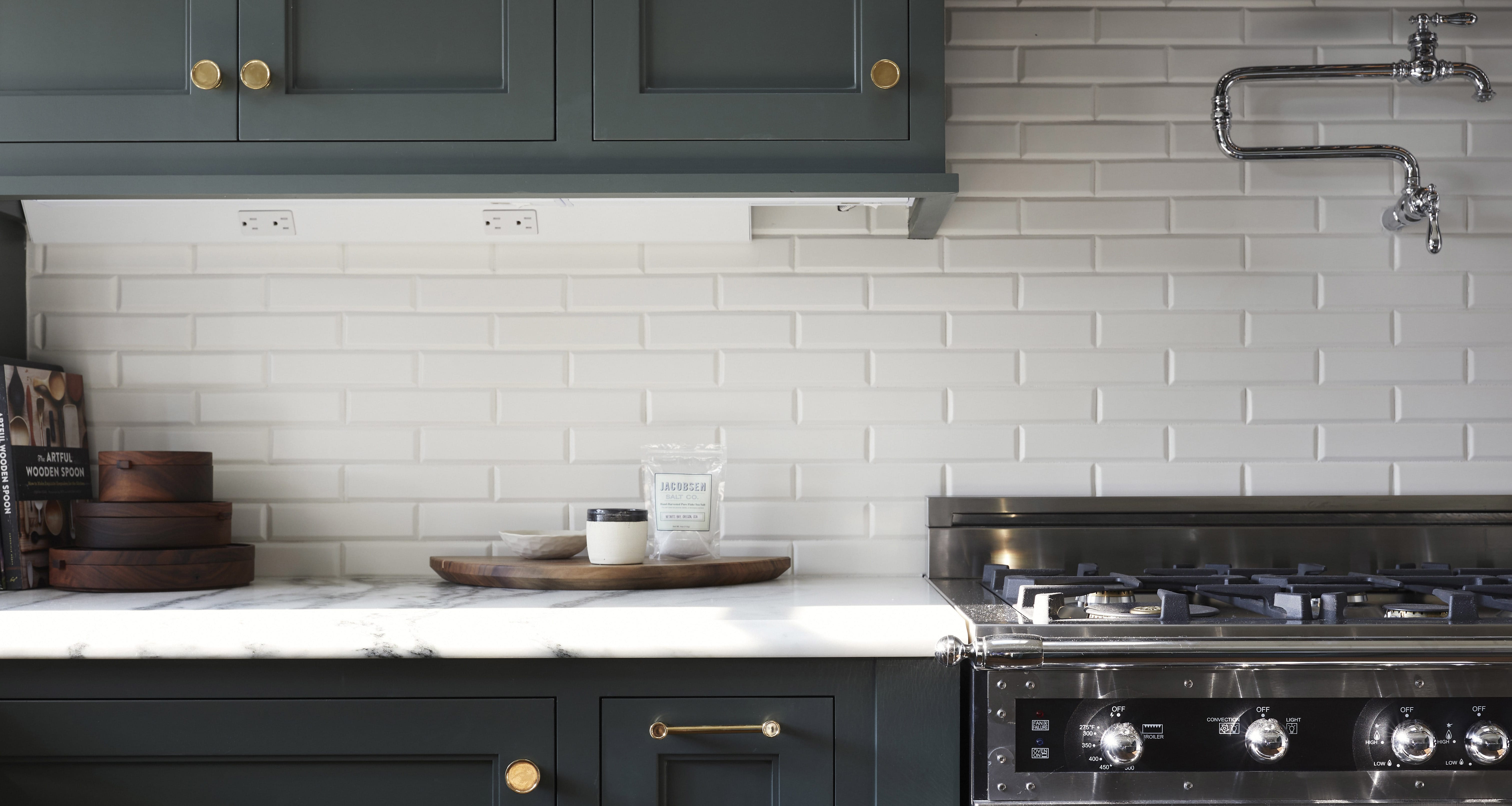Sage green kitchen cabinets white subway tile backsplash