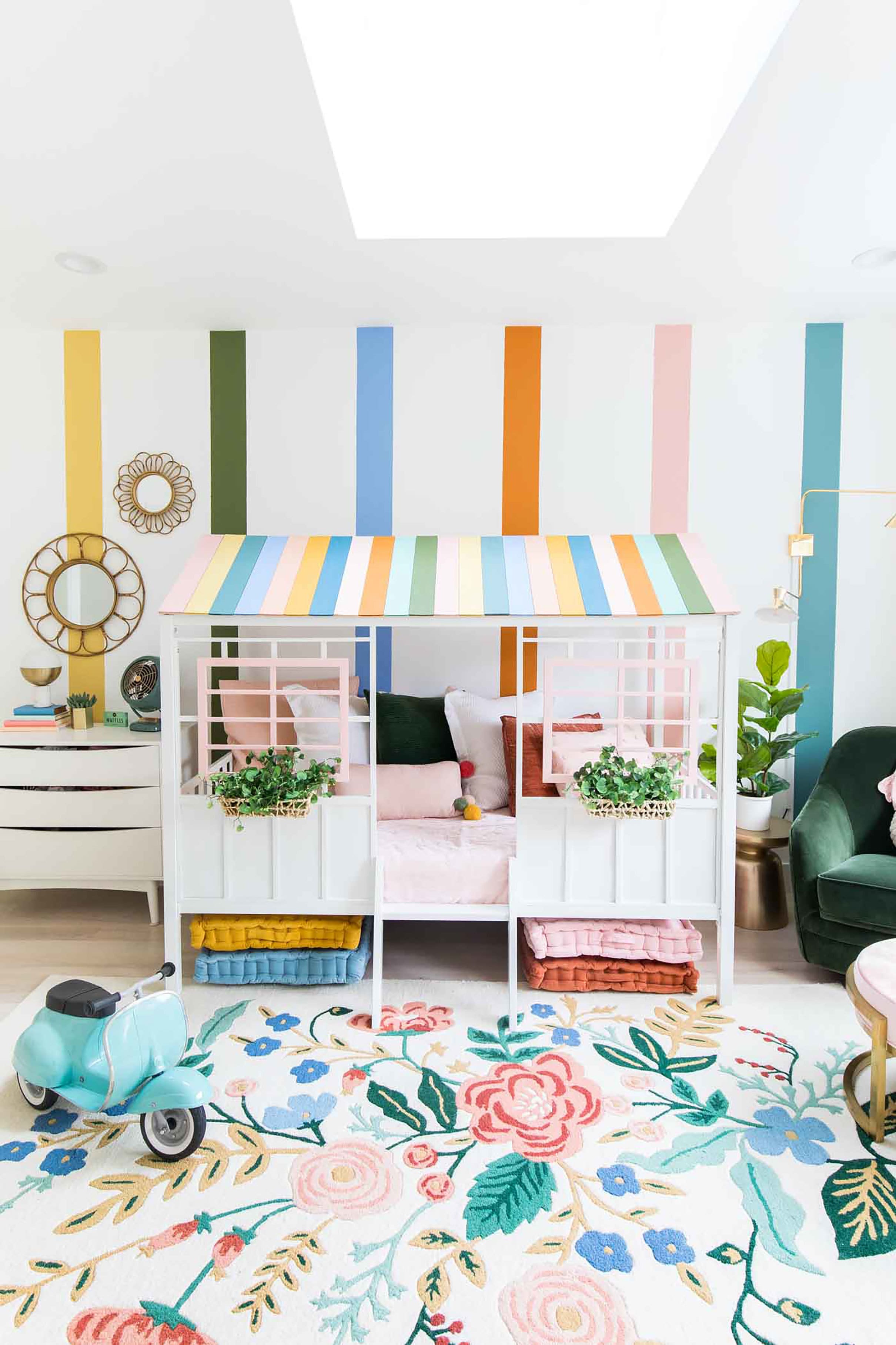 Pastel colored children's room with a skylight and playhouse bed
