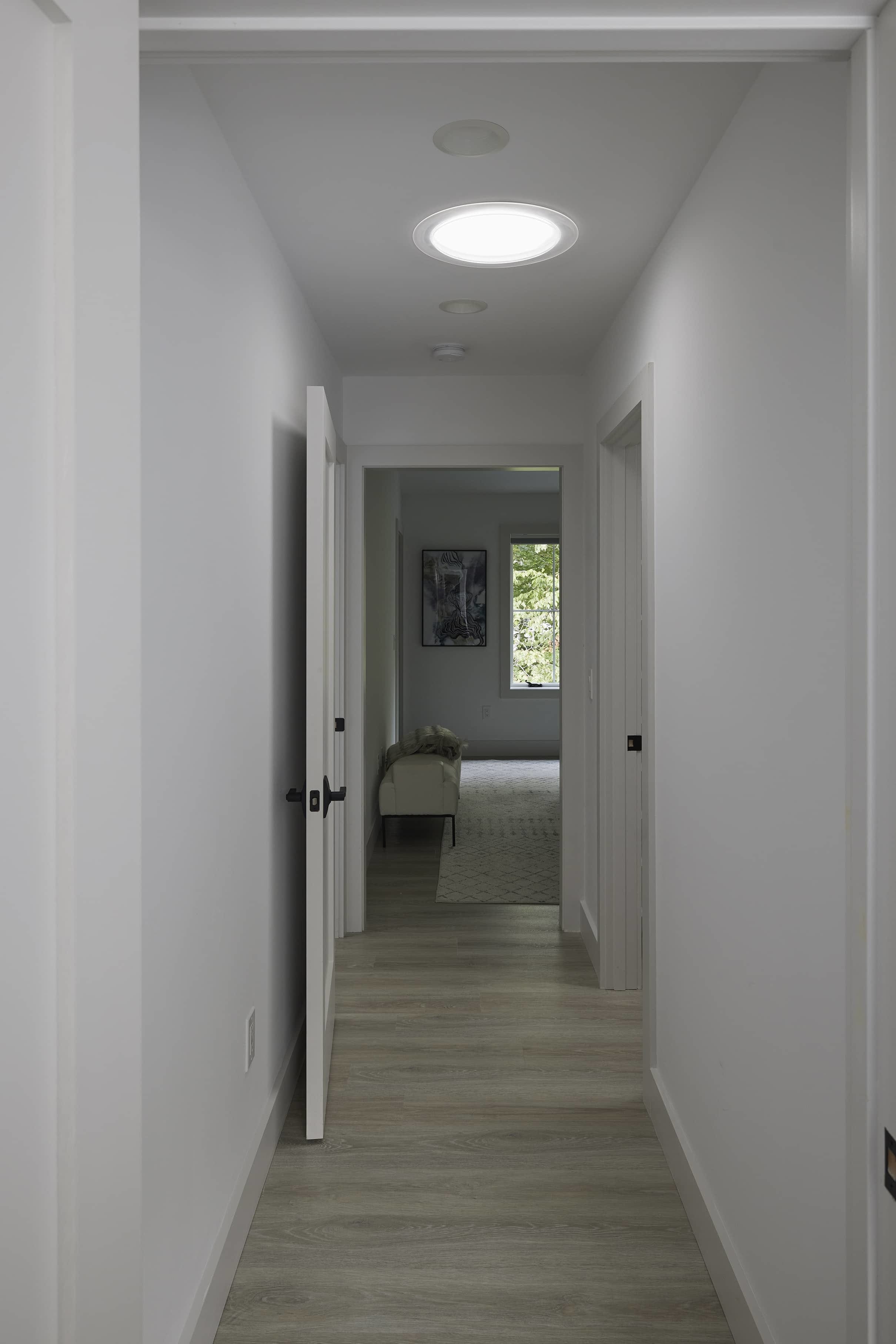 Hallway sun tunnel skylight connected to bedroom