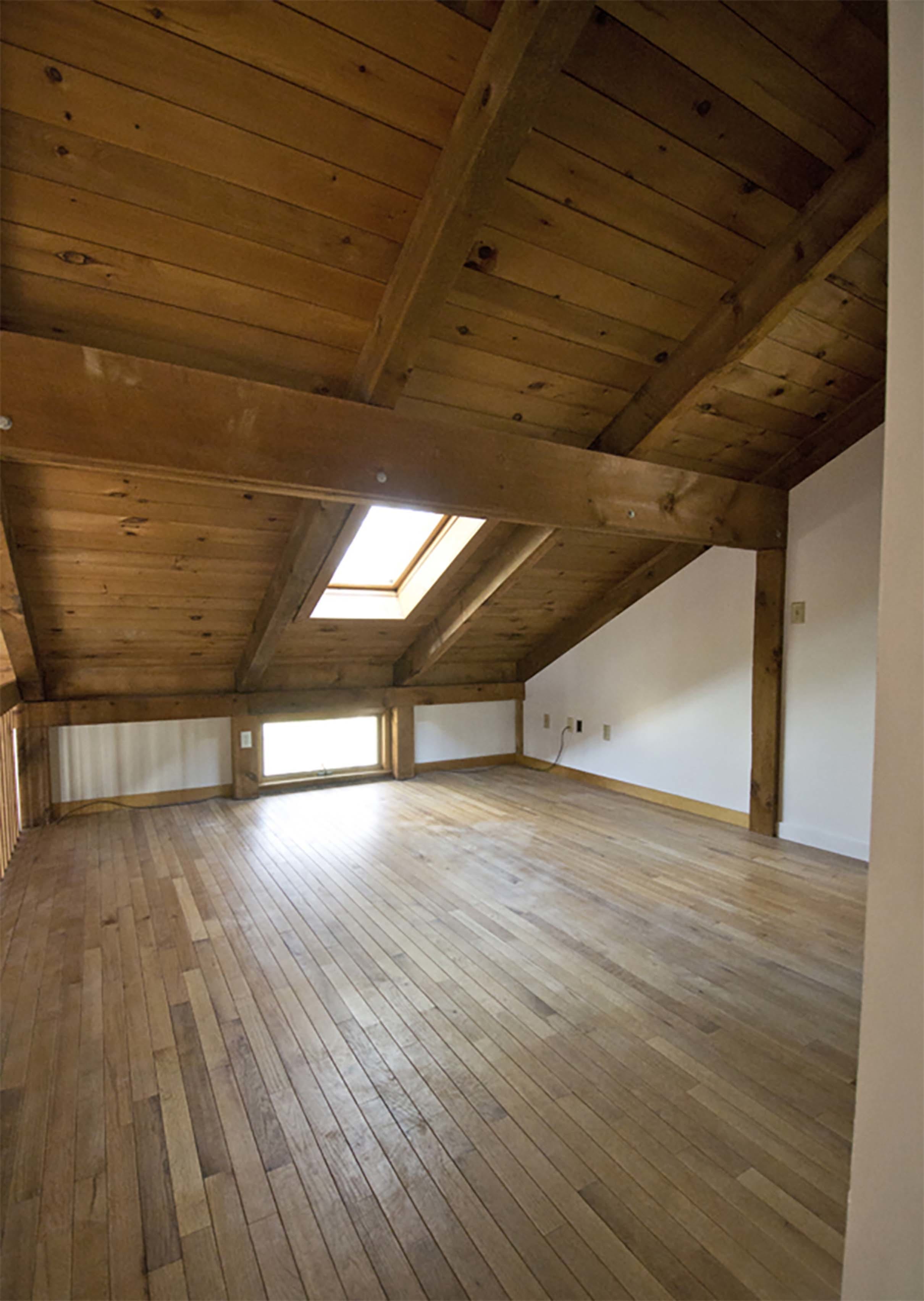 Loft natural wood skylight before renovation