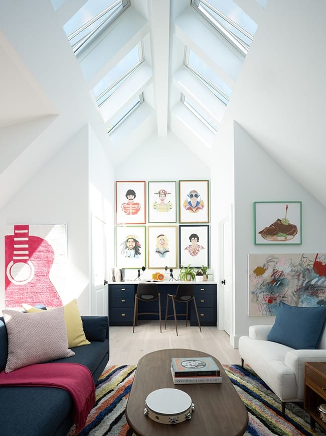 Skylights along a roof ridge brighten a living room