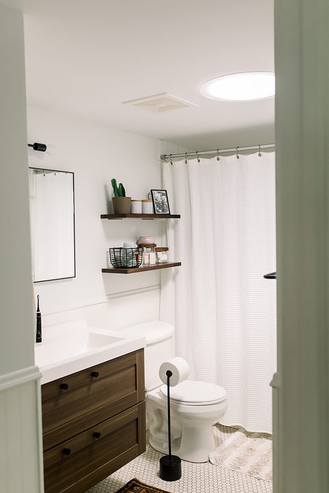 Small bathroom Sun Tunnel Skylight white wood