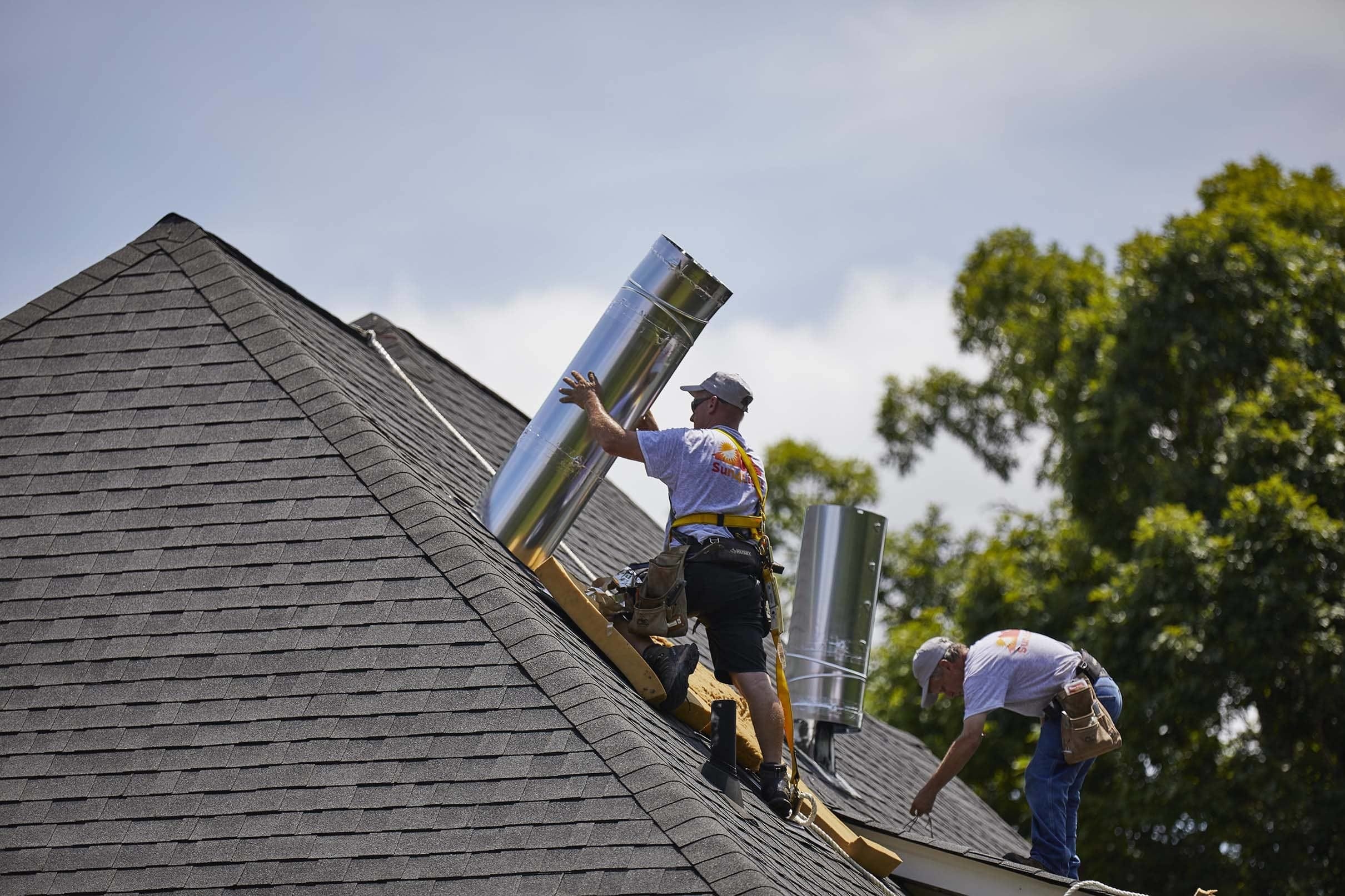 Sun Tunnel skylight installer on roof