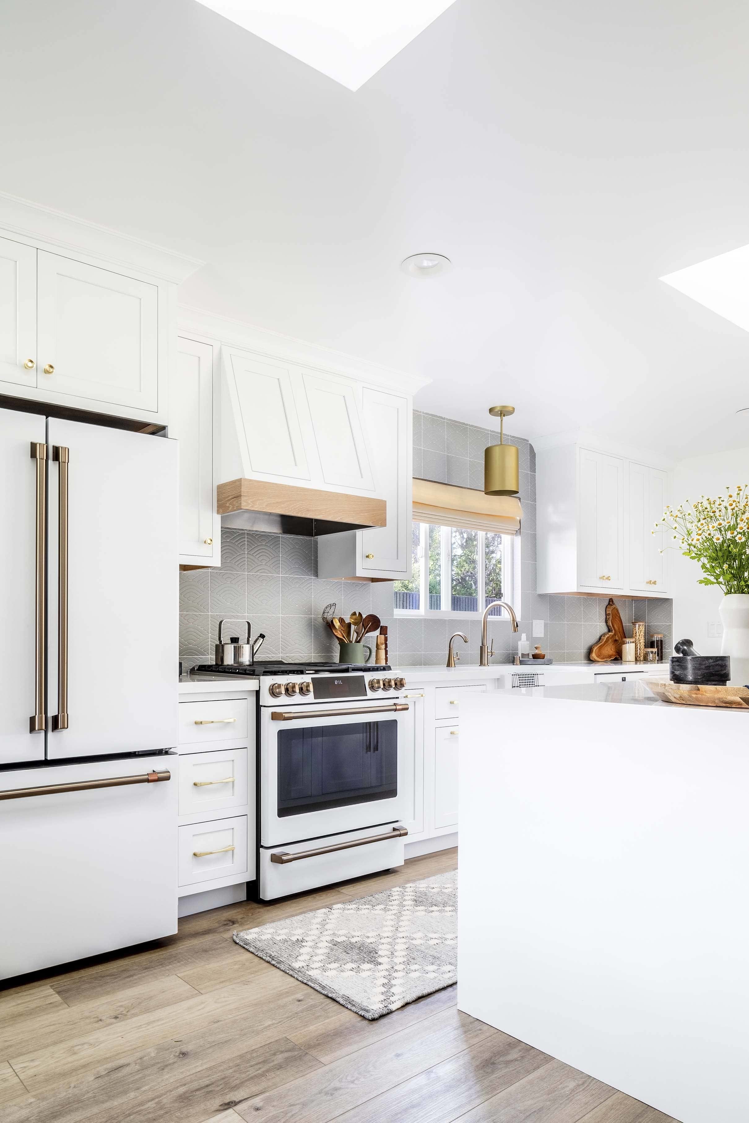 White kitchen refrigerator stove skylights