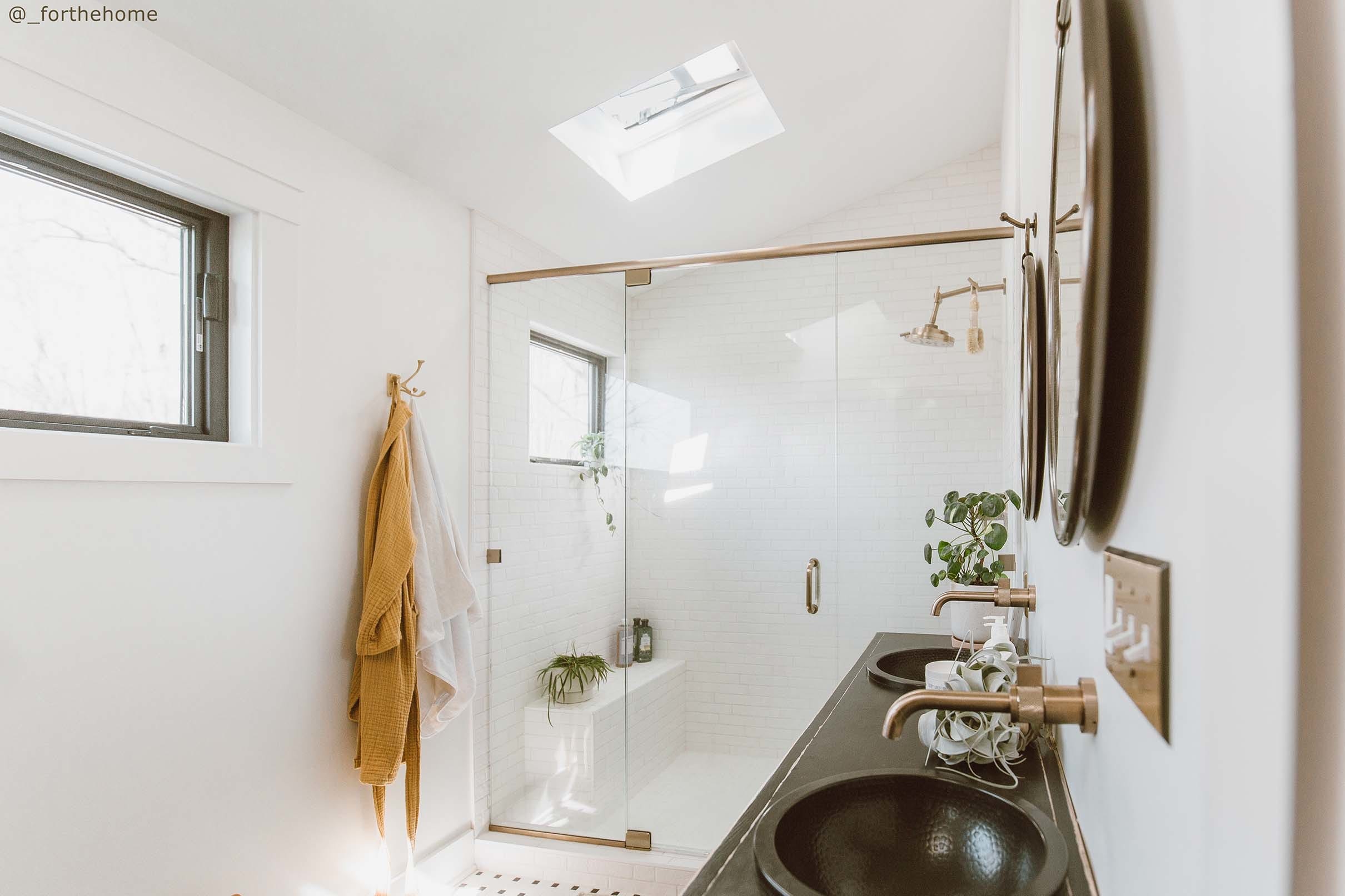 Bathroom white skylight shower black vanity