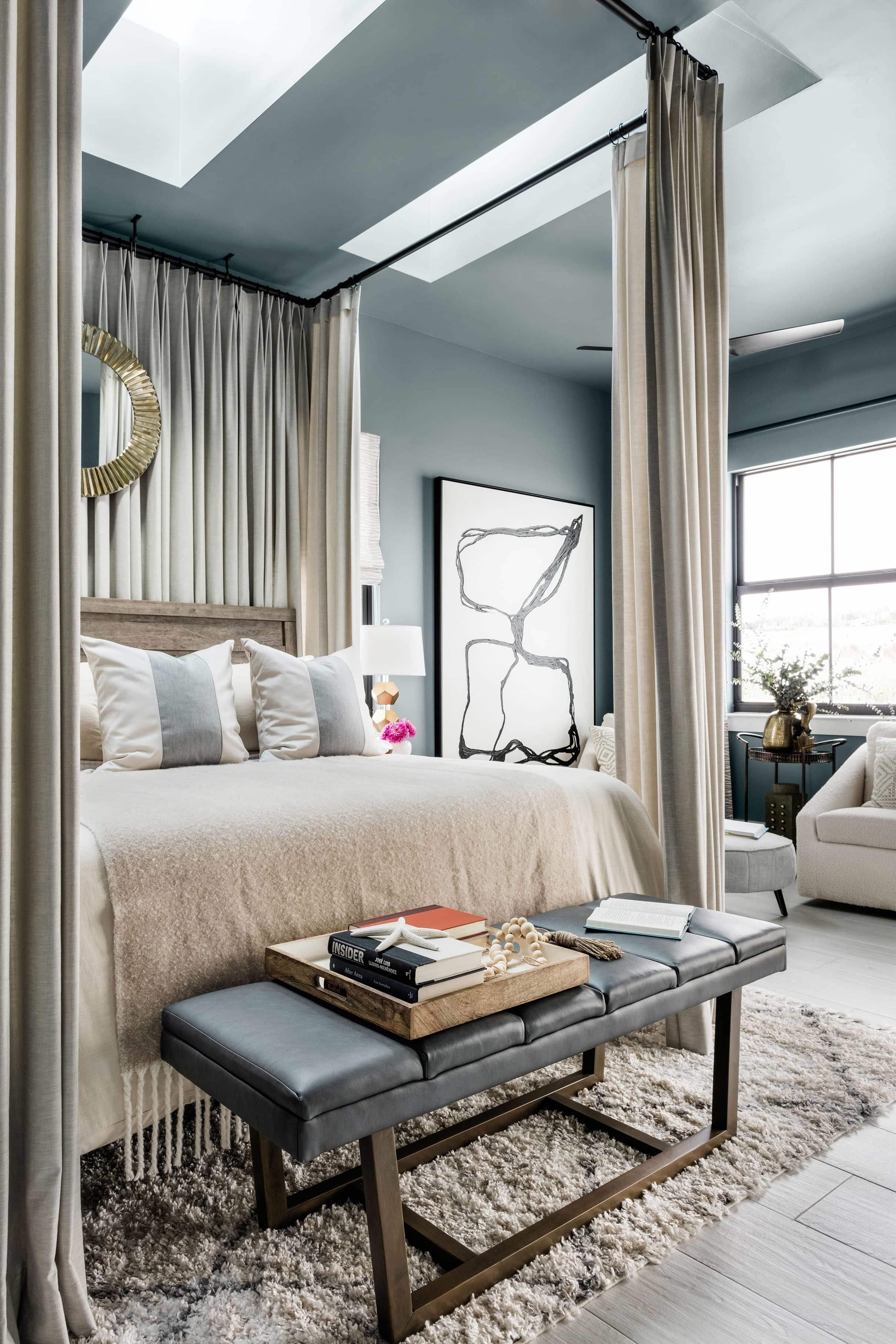 Bedroom blue taupe skylights framed bed