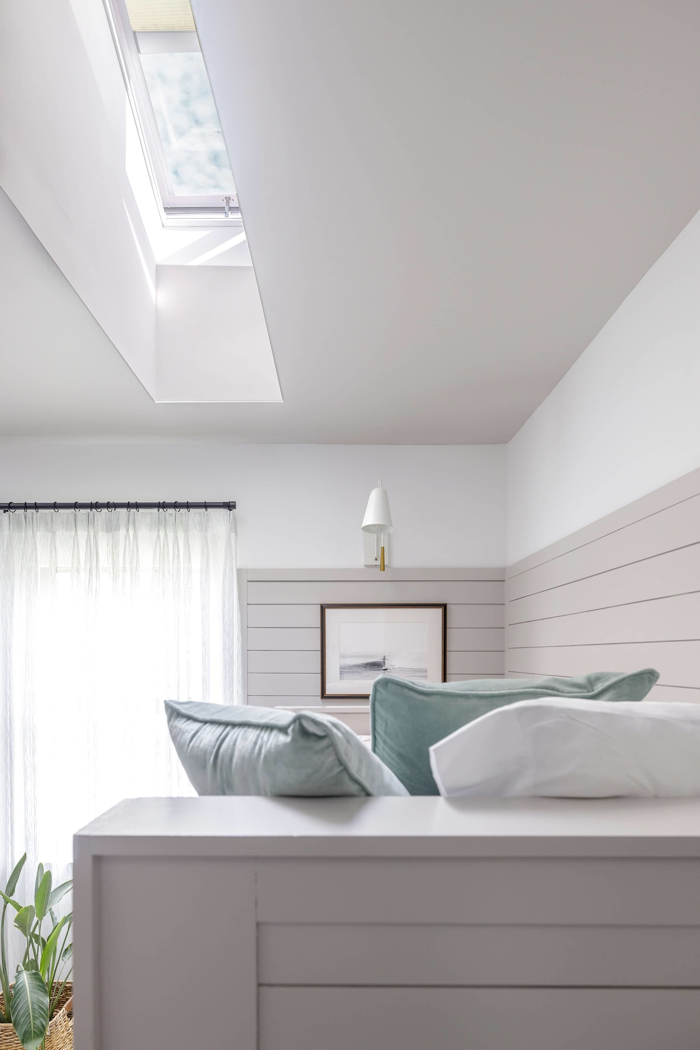 Bedroom bunk bed skylight grey white pillows