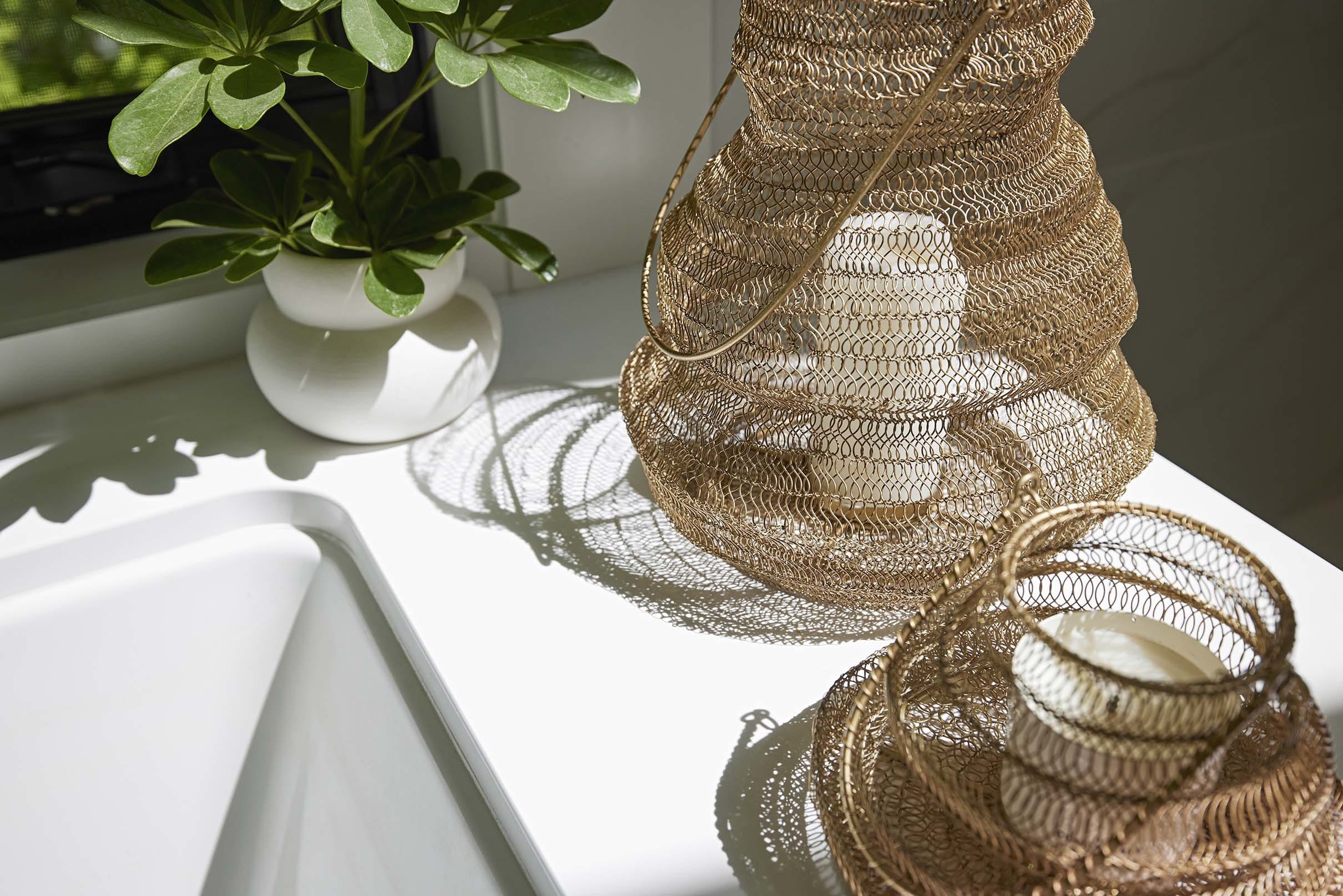 Brass candle baskets sunlight plant