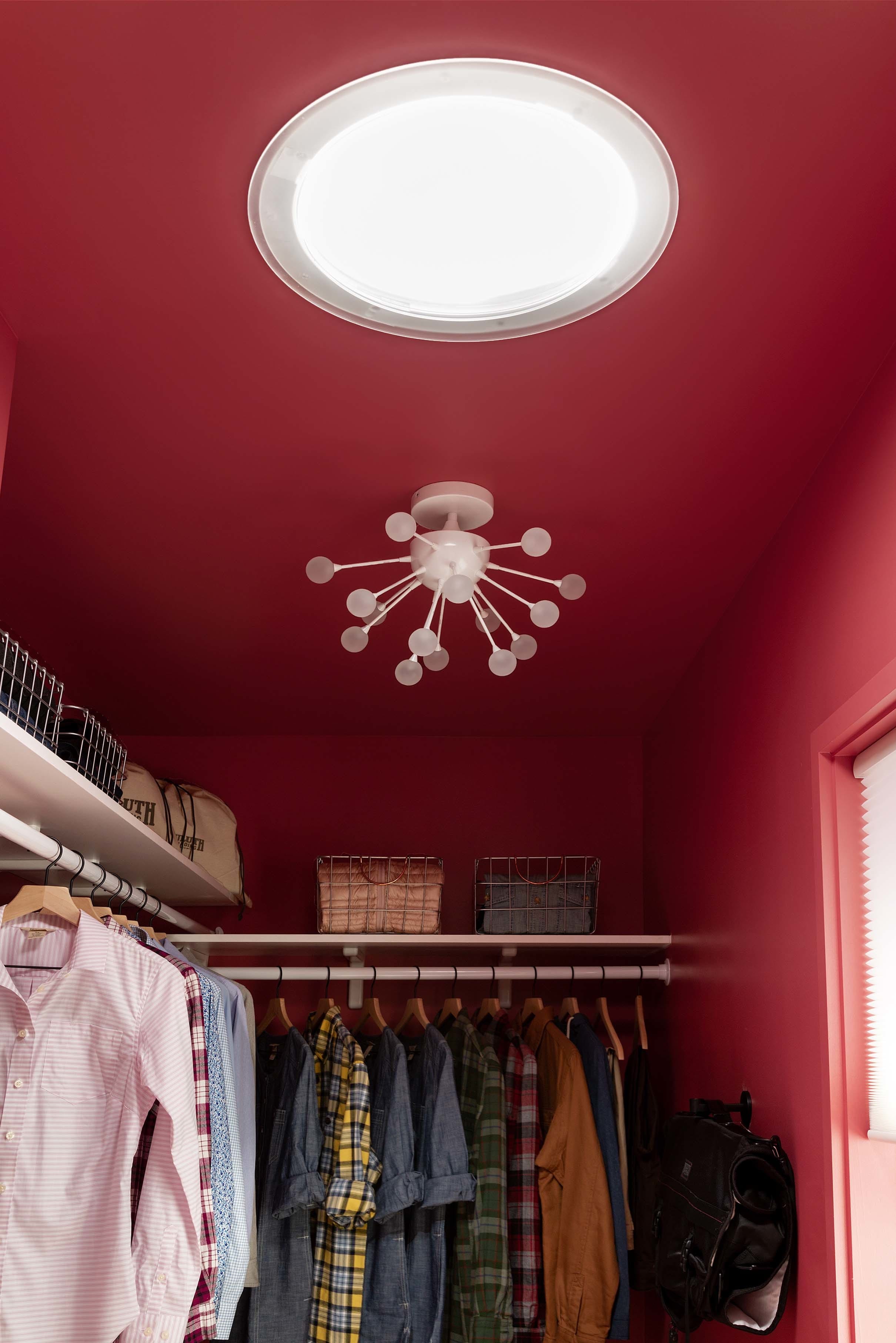 Closet dark pink walls Sun tunnel skylight