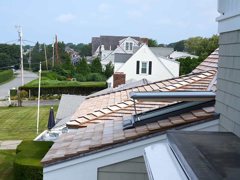 Skylight open on a wooden shake roof