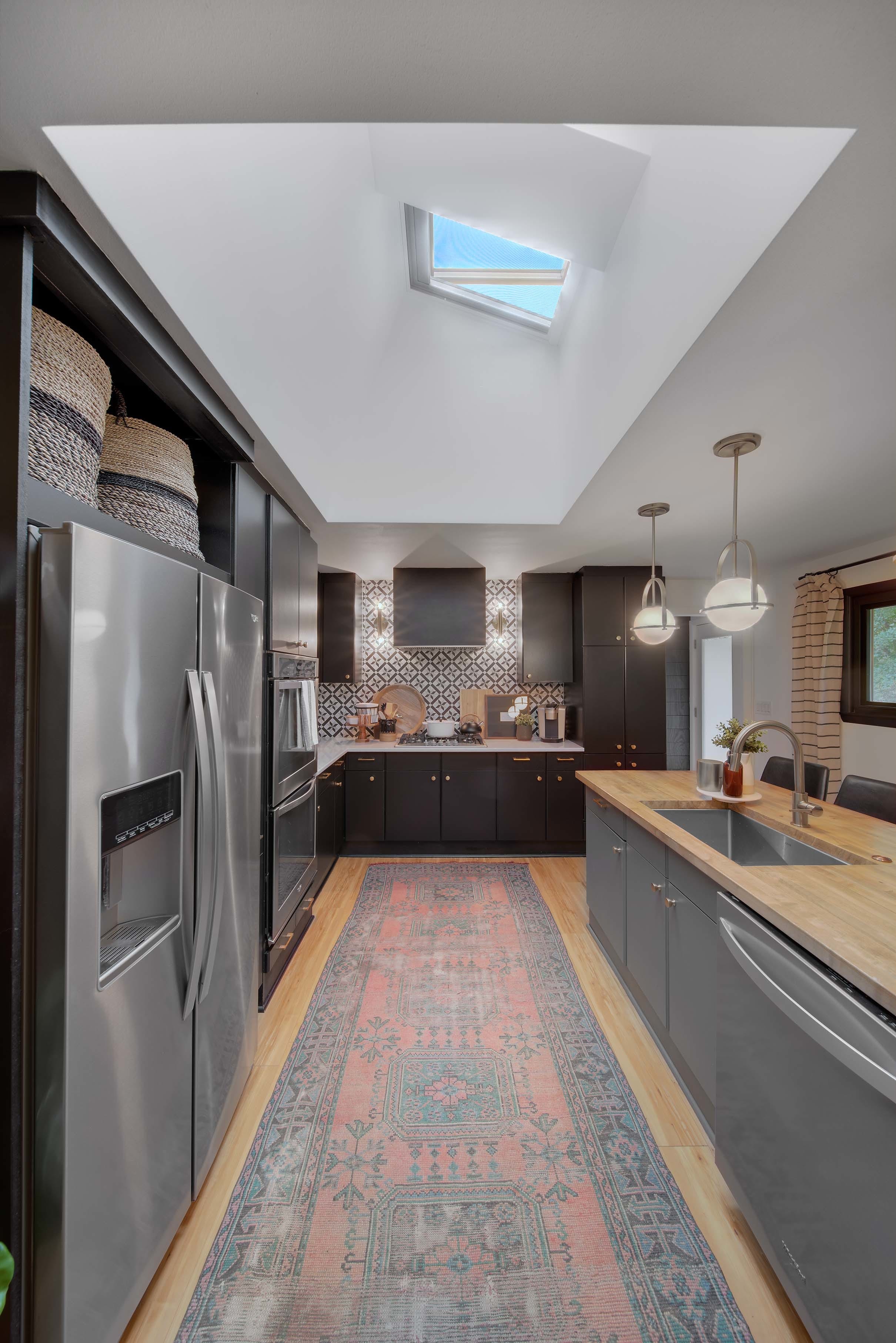 Kitchen open skylights vintage rug butcher block island