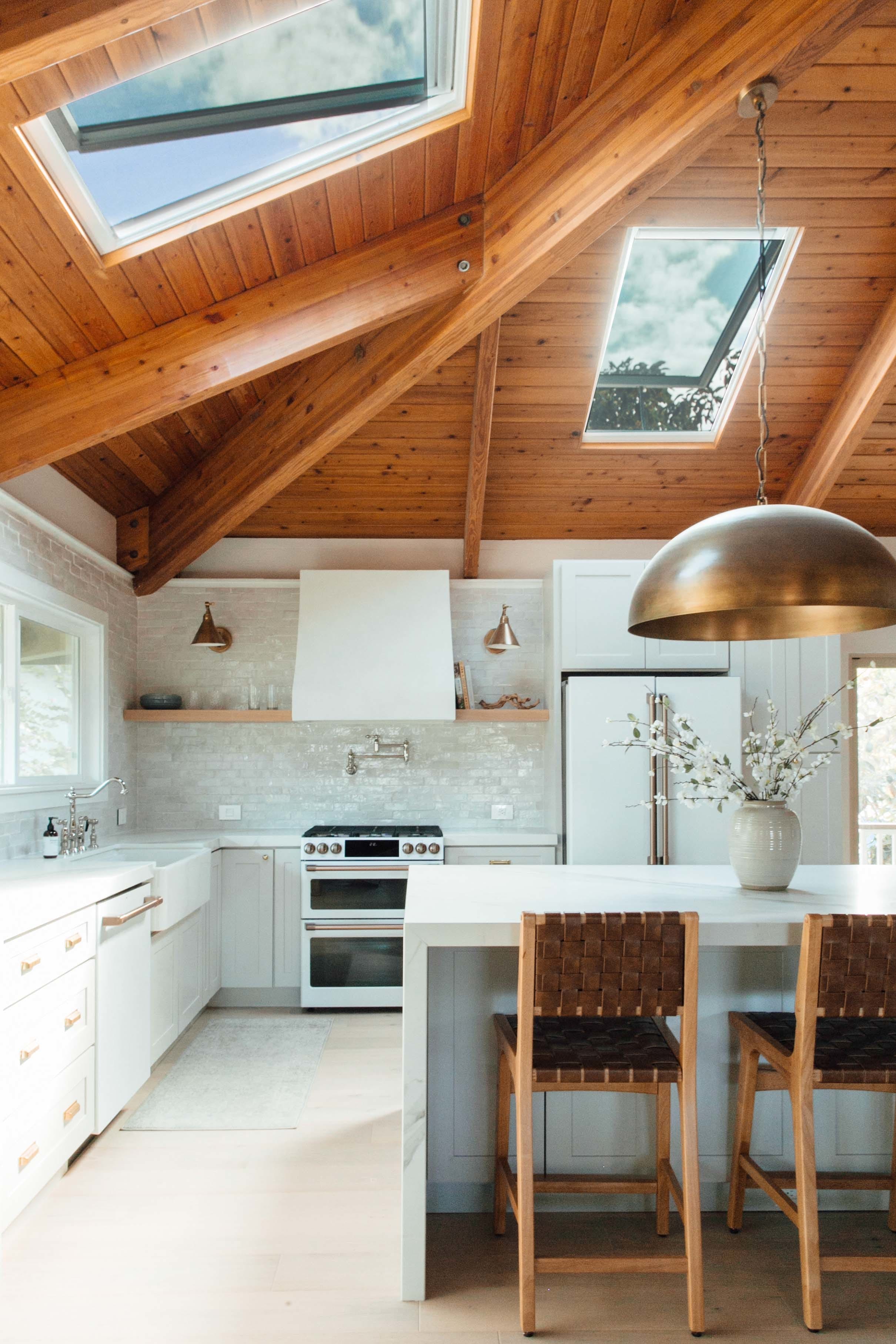 Kitchen skylights wood panel ceiling brass fixtures