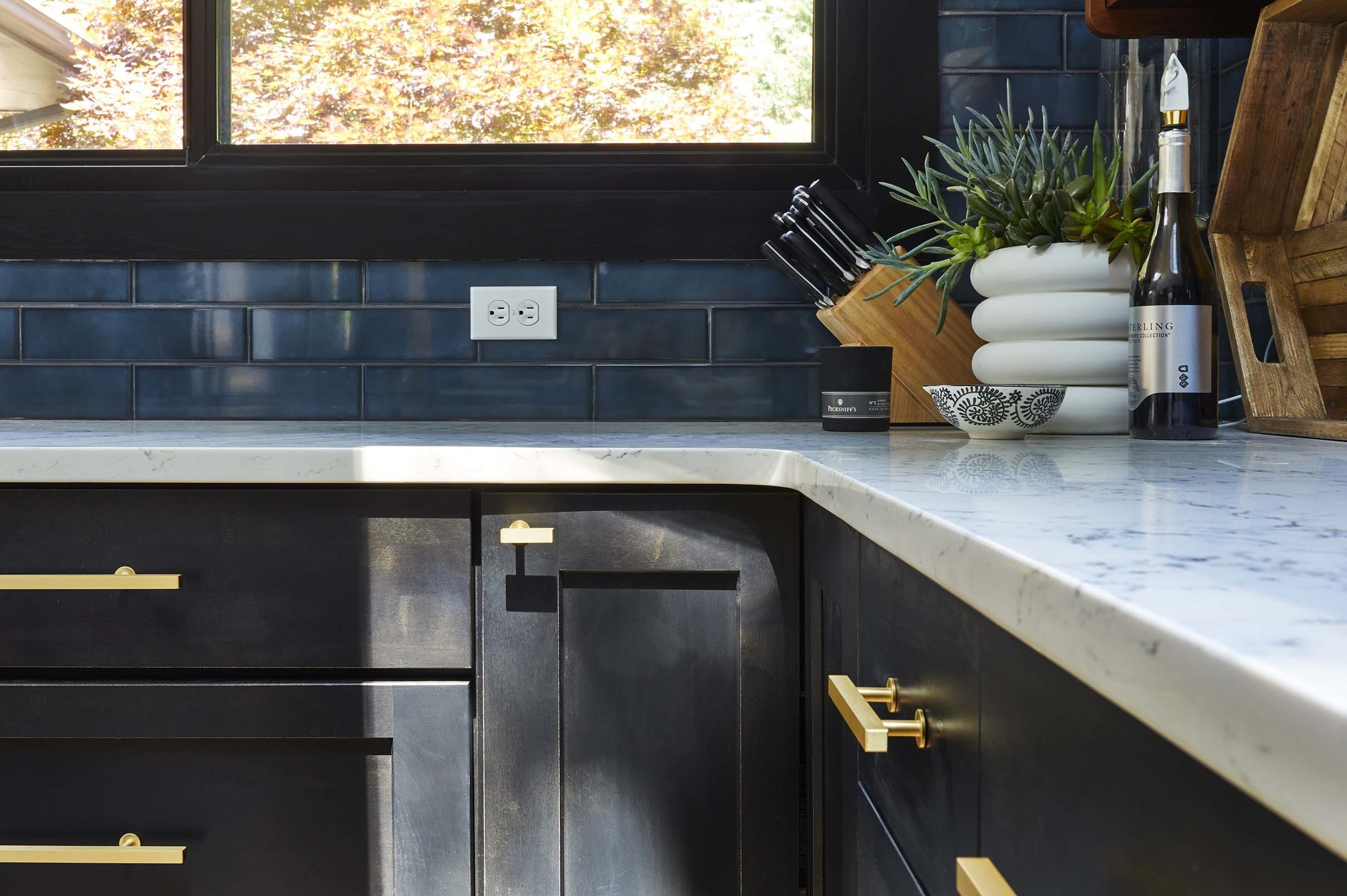 sunlight across black kitchen cabinets
