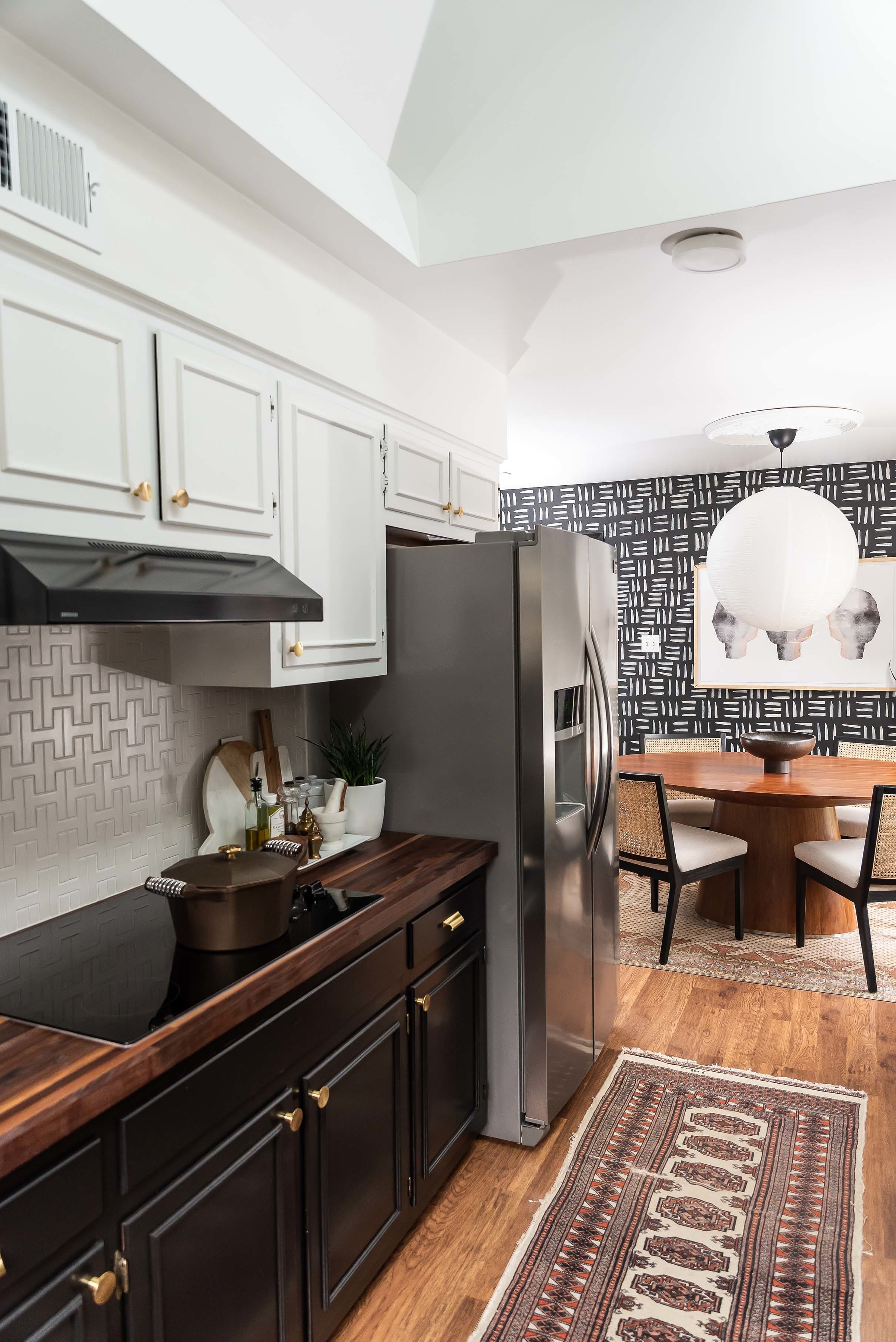 Kitchen white backsplash black cabinets skylights