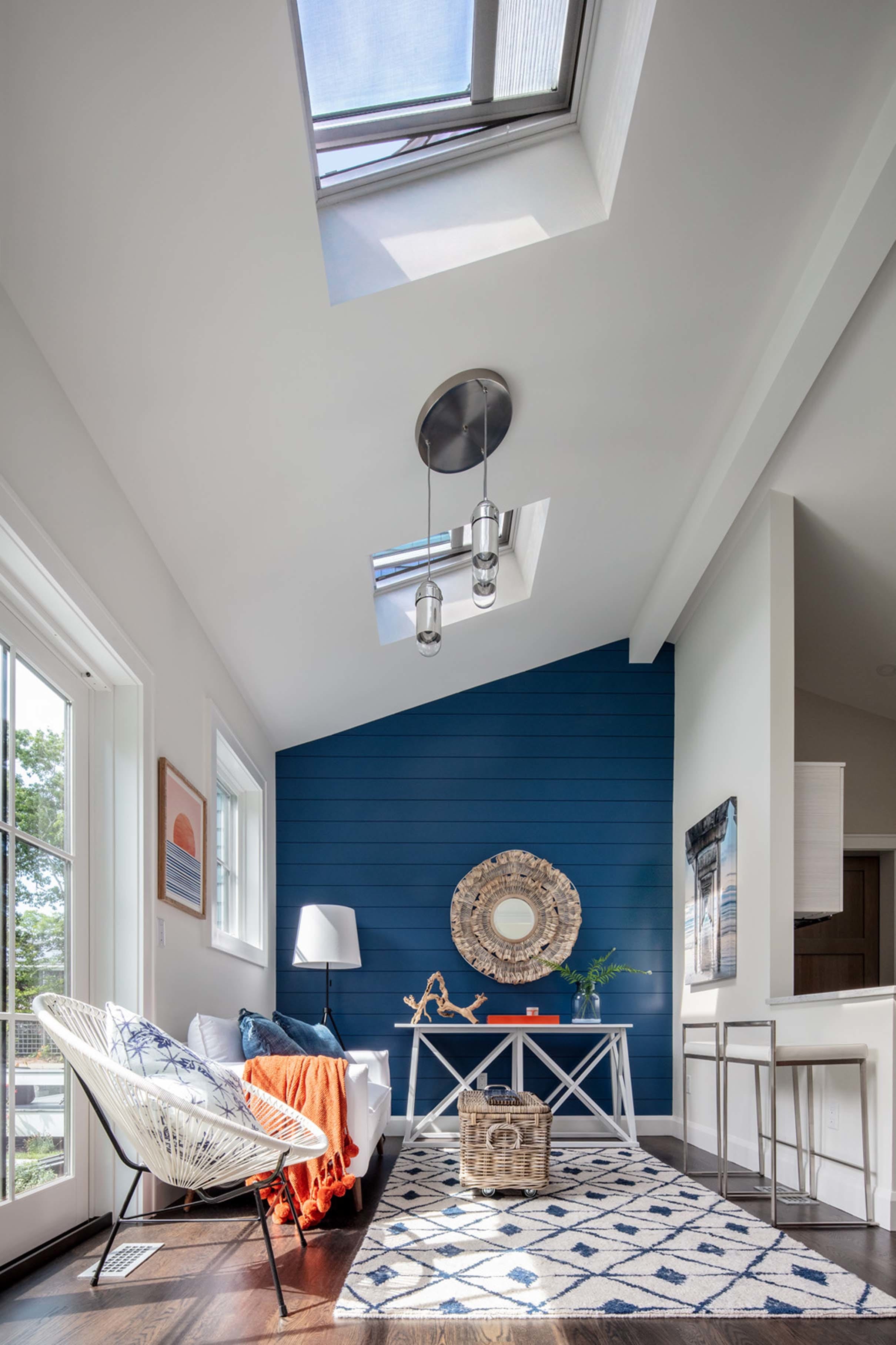 Living room skylights blue accent wall