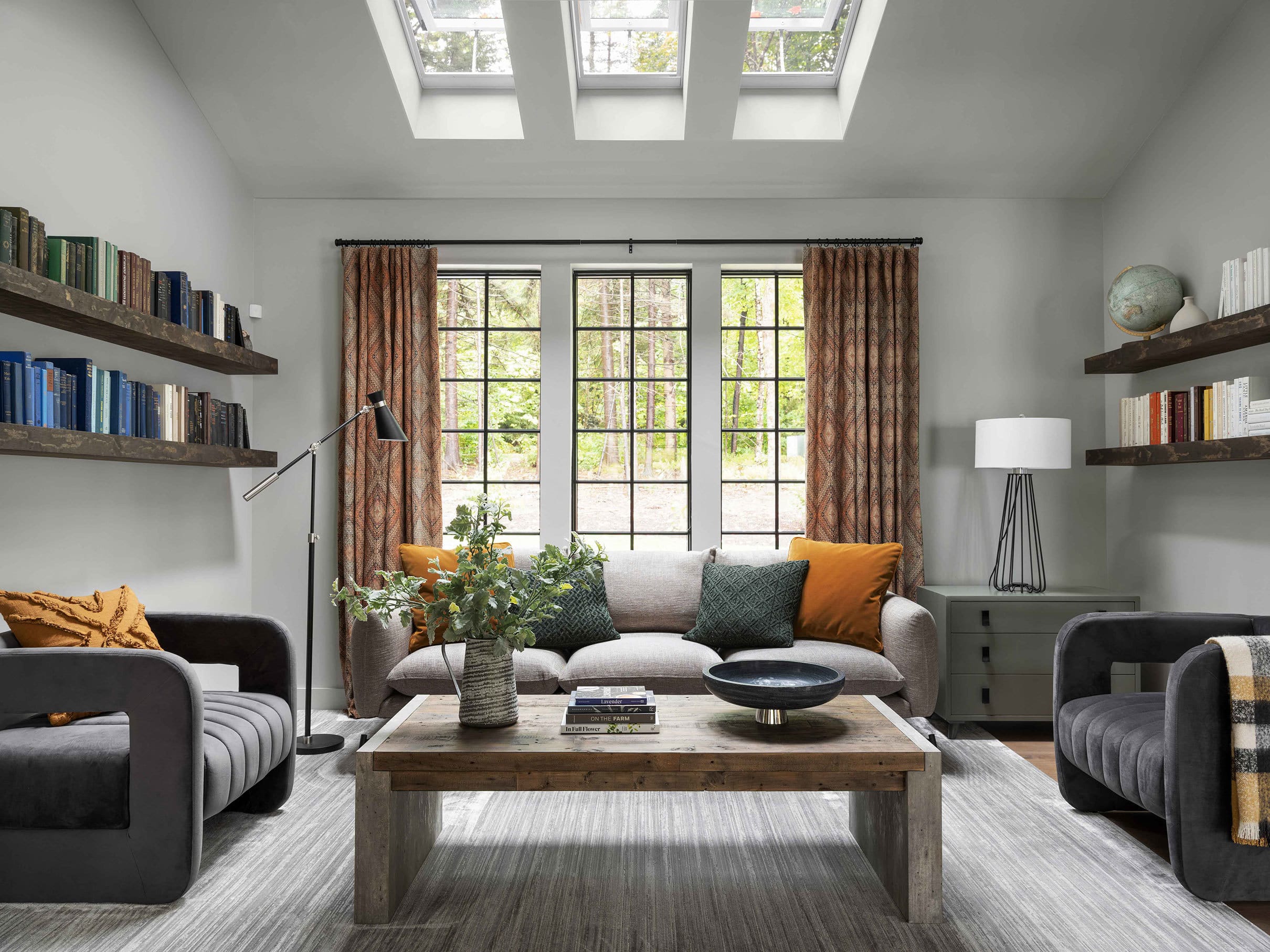 Living room skylights orange gray floating shelves