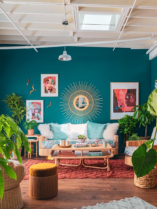 Livng room with skylight torquoise wall plants
