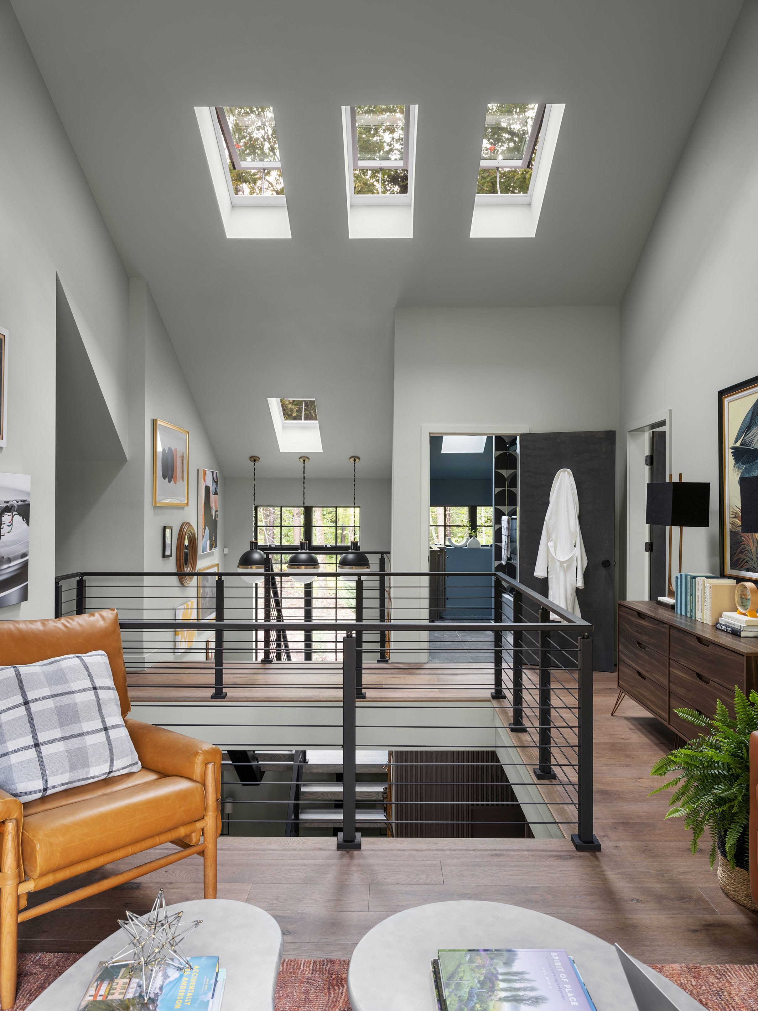Loft skylights stairwell wood floor white walls