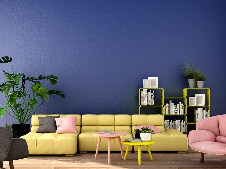 room with yellow sofa blue wall and plants