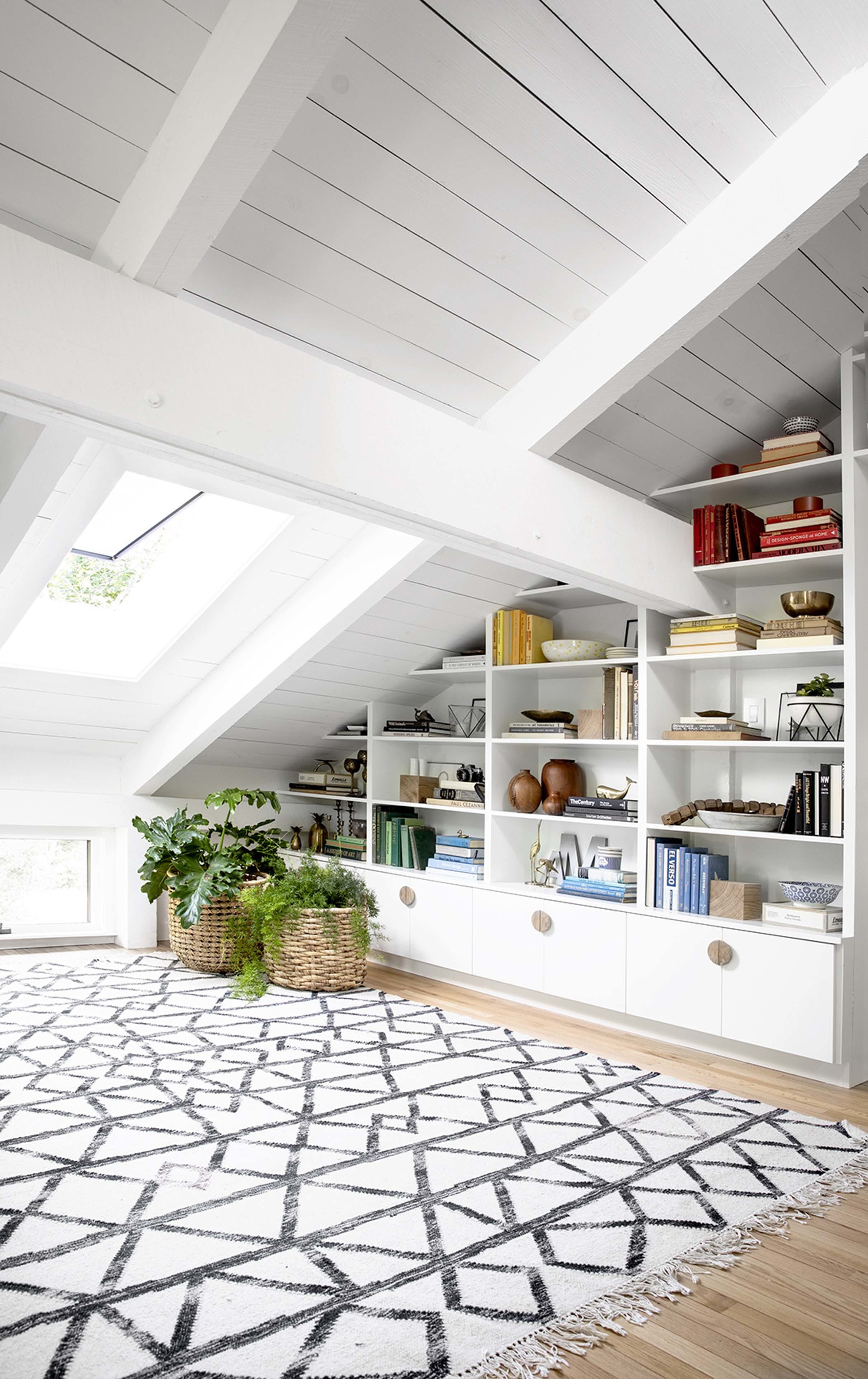 Skylight built in bookshelves white wood finish