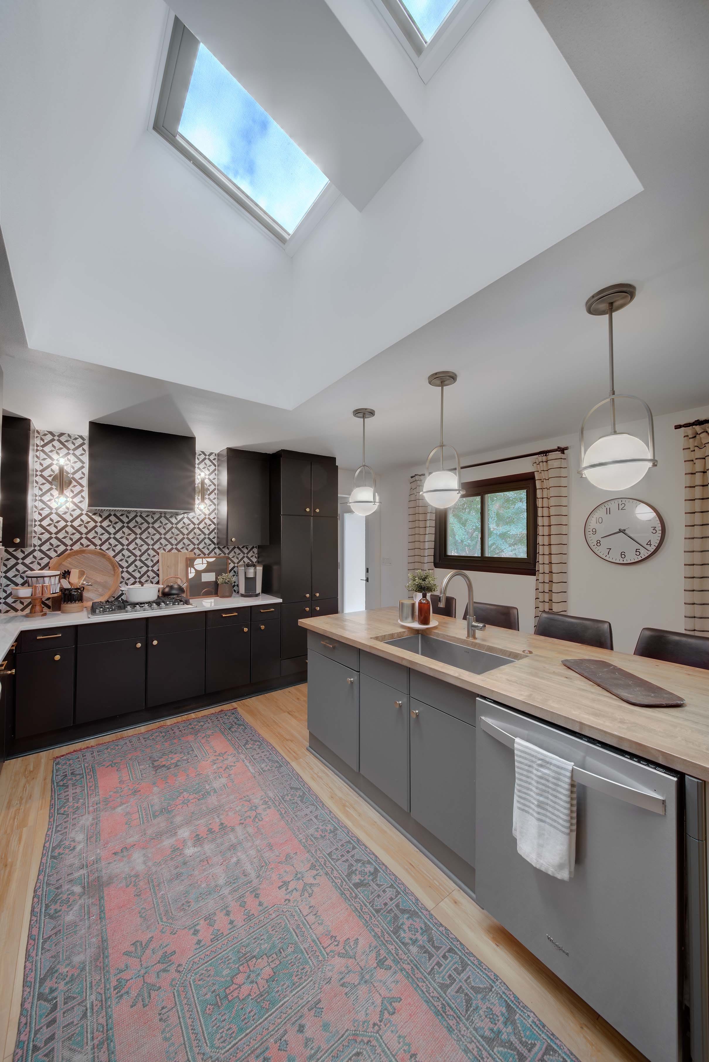 Skylights flat ceiling kitchen black cabinets