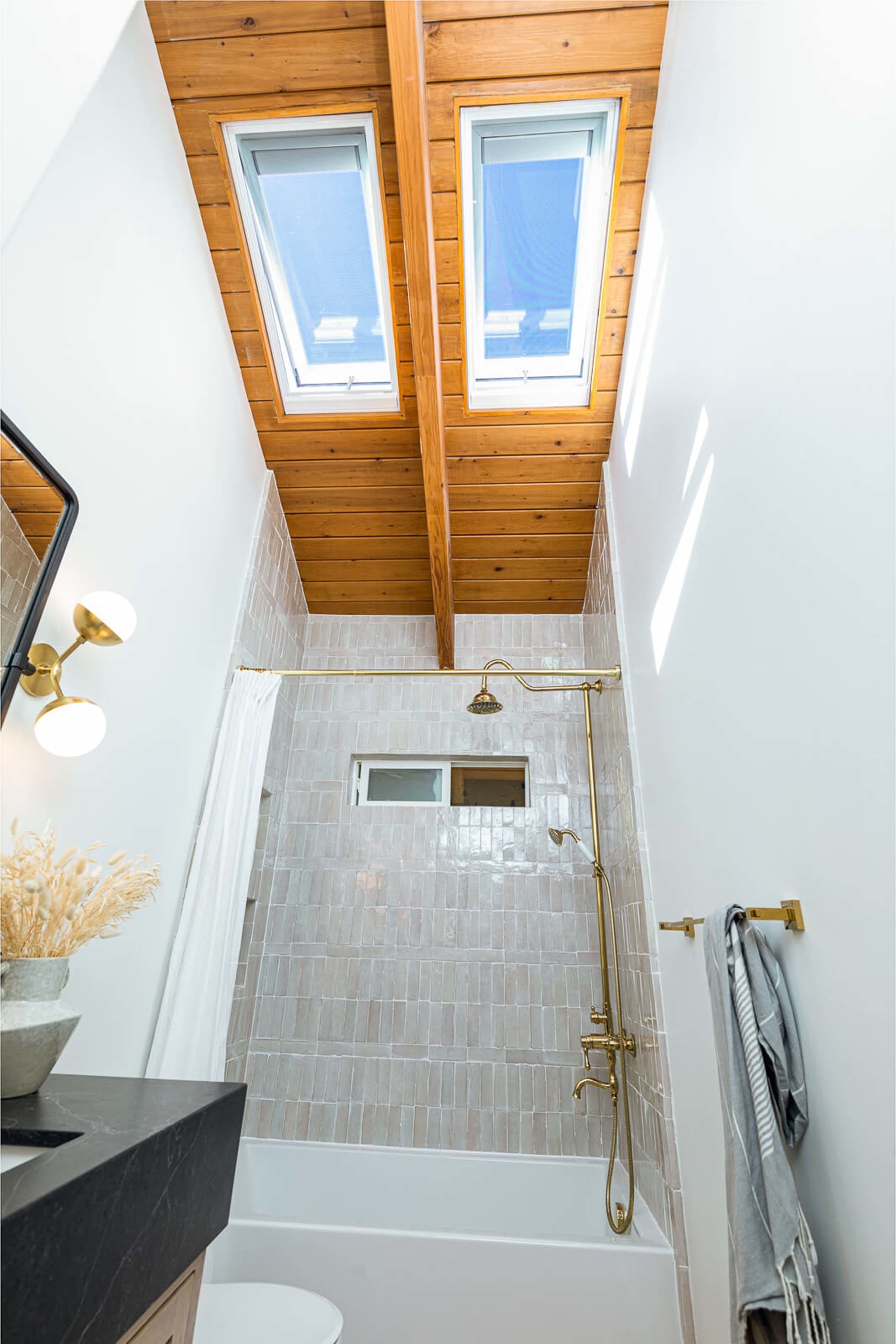 Small bathroom two skylights wooden ceiling